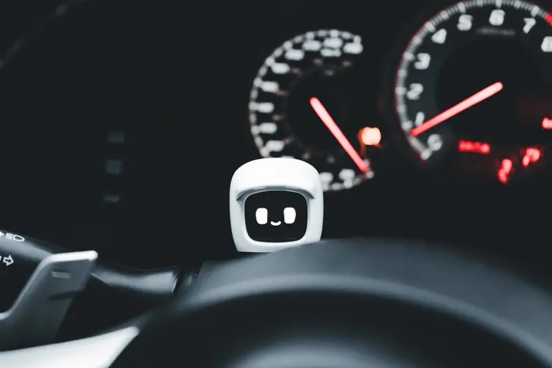A small AI assistant device on a dashboard, illustrating how AI automation quietly runs routine business workflows in the background