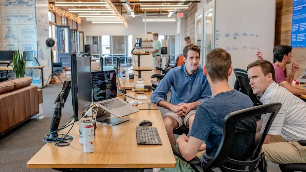 A team working together, illustrating agentic AI systems that plan and complete tasks