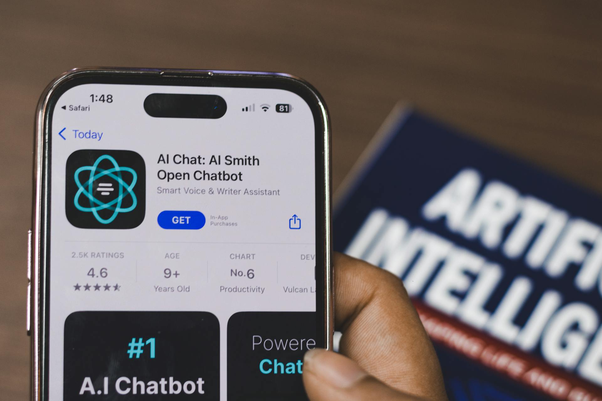 Hand holding a smartphone with AI chatbot app representing AI agent automation