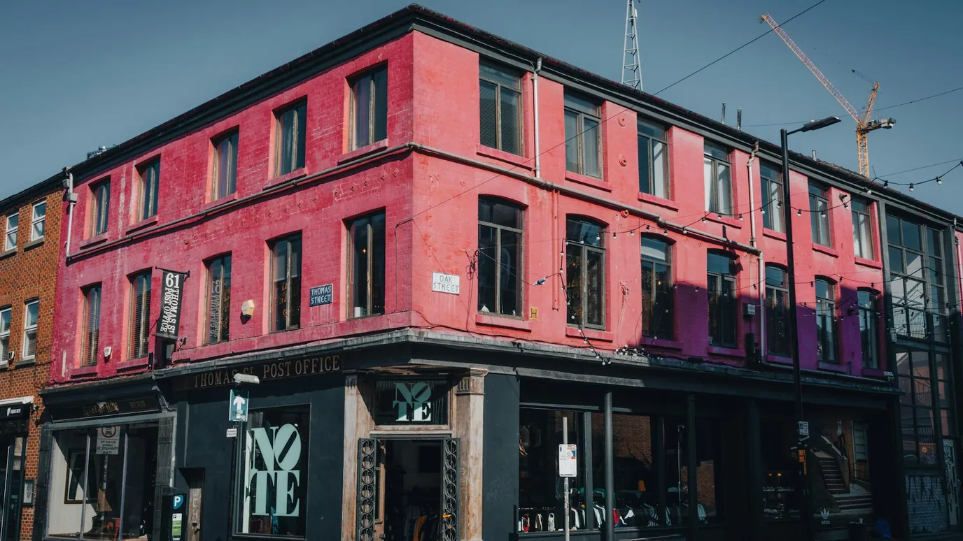 A red brick corner building at Thomas Street and Oak Street in the Northern Quarter, Manchester