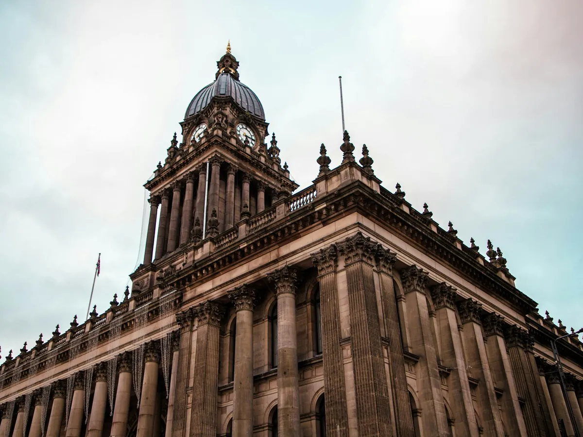 Leeds Town Hall and its domed clock tower seen from street level