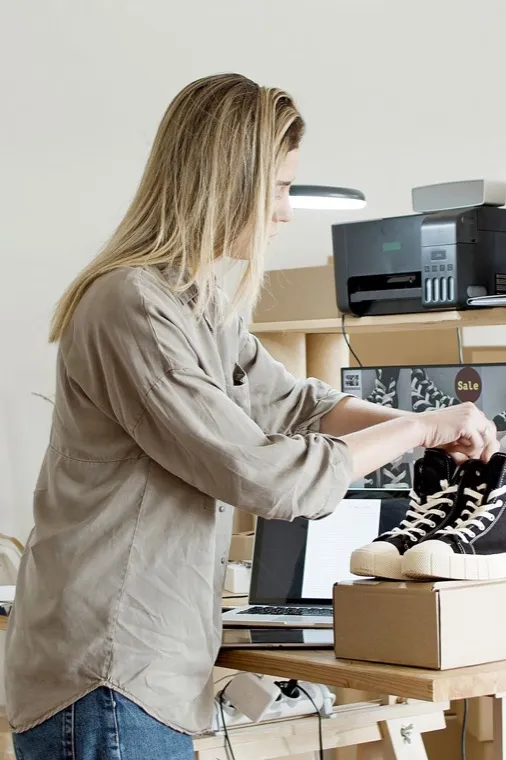 Ecommerce business owner preparing an online order for shipping